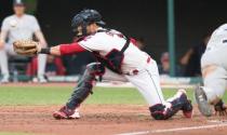 Jul 13, 2018; Cleveland, OH, USA; Cleveland Indians catcher Yan Gomes (7) misplays the ball on a sacrifice hit by New York Yankees left fielder Brett Gardner as New York Yankees second baseman Neil Walker (14) sores during the fifth inning at Progressive Field. Mandatory Credit: Ken Blaze-USA TODAY Sports