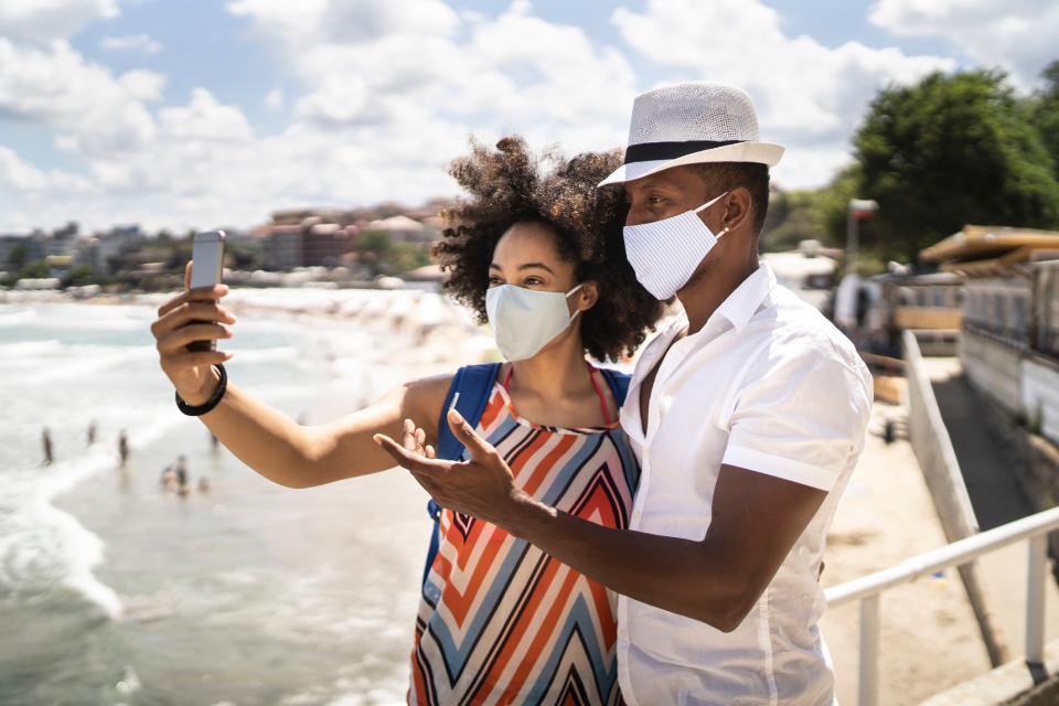 Will your summer holiday destination require you to wear a face mask? (Getty Images)