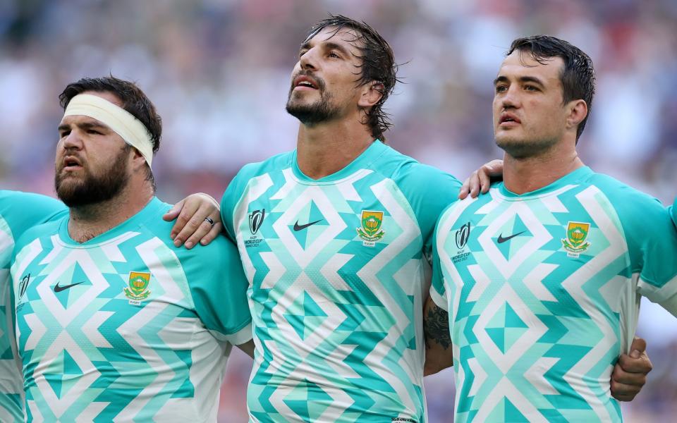 Frans Malherbe, Eben Etzebeth and Franco Mostert of South Africa line up during the National Anthems prior to the Rugby World Cup France 2023 match between South Africa and Scotland at Stade Velodrome on September 10, 2023 in Marseille, France