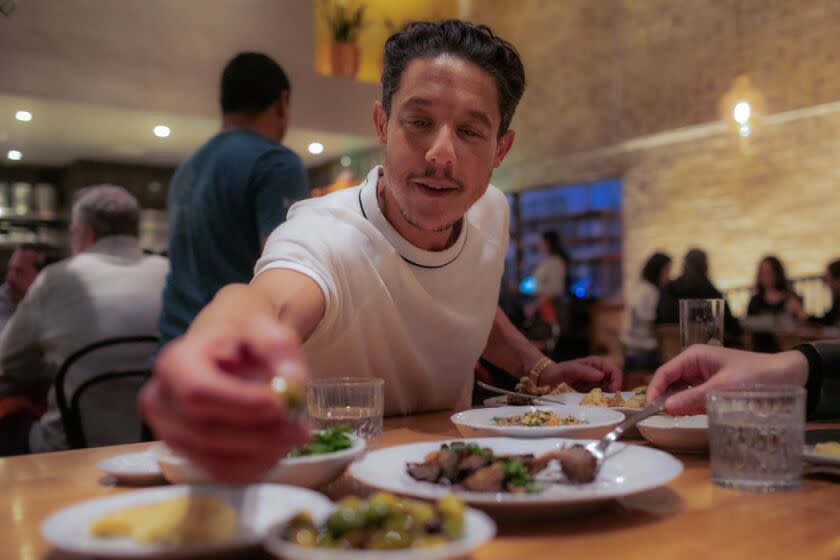 LOS ANGELES, CA - FEBRUARY 13: Actor Theo Rossi enjoys some olives at Bavel restaurant