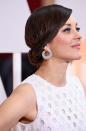 Lastly, hairstylist Robert Vetica created a 1920s inspired look for Marion Cotillard. Vetica created a low side part and used a strong hold gel to shape the star’s hair before twisting and pinning her locks in place.