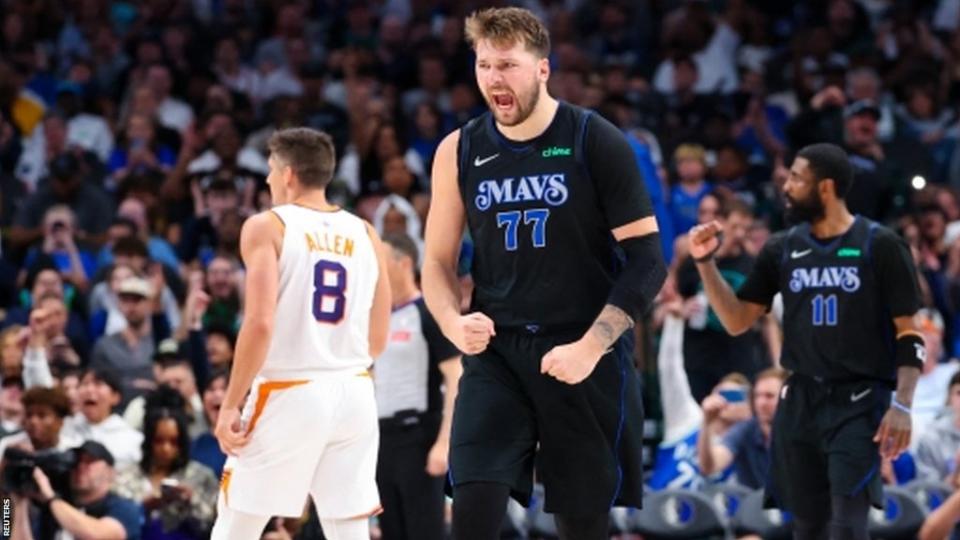 Luka Doncic and Kyrie Irving celebrate