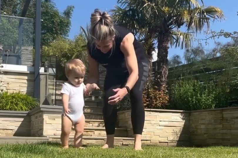 Gemma's toddler is seen walking round her garden, much to her fans' delight