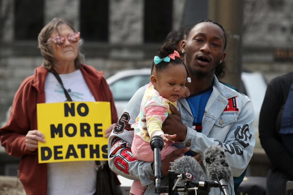 Cane Weitherspoon holds his daughter, Ca'Nari, 10 months, during a press conference and vigil held at Jefferson Square Park to call attention to the eight jail deaths in recent months.  Weitherspoon's mother, Stephanie Dunbar died from a suicide at the jail on December 4, 2021.