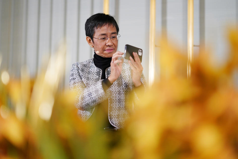 Filipino journalist Maria Ressa sits with fellow peace Prize winner Russian journalist Dmitry Muratov, during a press conference, at the Nobel Institute, a day prior to the award ceremony, in Oslo, Norway, Thursday, Dec. 9, 2021. (Torstein Boe/Pool Photo via AP)