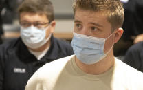 Michael Wells-Whitworth, right, a paramedic from Texas arrives with nearly three dozen healthcare workers from around the country to help supplement the staff at Our Lady of the Lake Regional Medical Center in Baton Rouge, La., Monday, Aug. 2, 2021. Louisiana has one of the lowest coronavirus vaccination rates in the nation and is seeing one of the country’s worst COVID-19 spikes. (AP Photo/Ted Jackson)