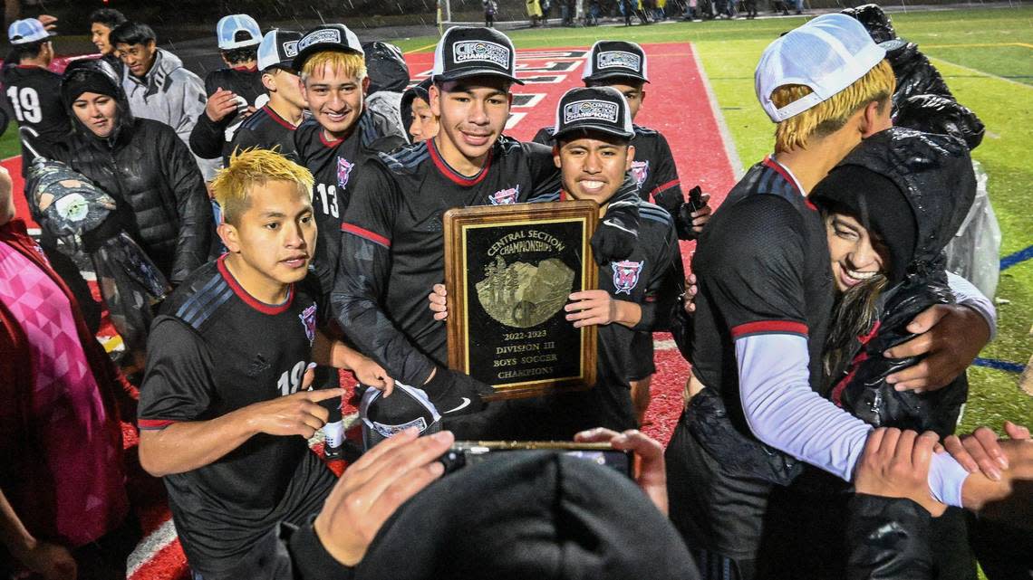 McLane High boys soccer players celebrate their Central Section Division III boys soccer championship win over Chavez at McLane Stadium on Friday, Feb. 24, 2023.