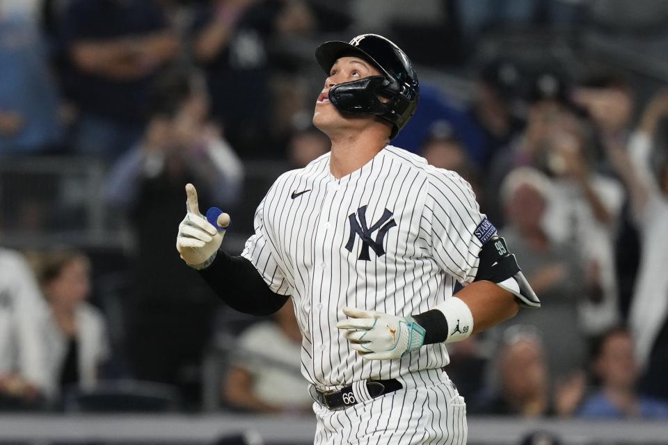 New York Yankees' Aaron Judge gestures as he runs the bases after hitting a home run against the Washington Nationals during the seventh inning of a baseball game Wednesday, Aug. 23, 2023, in New York. (AP Photo/Frank Franklin II)