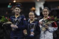 First place all around winner Morgan Hurd of the United States is flanked by second place winner Kayla DiCello of the United States and third place winner Hitomi Hatakeda of Japan after the America Cup gymnastics competition Saturday, March 7, 2020, in Milwaukee. (AP Photo/Morry Gash)