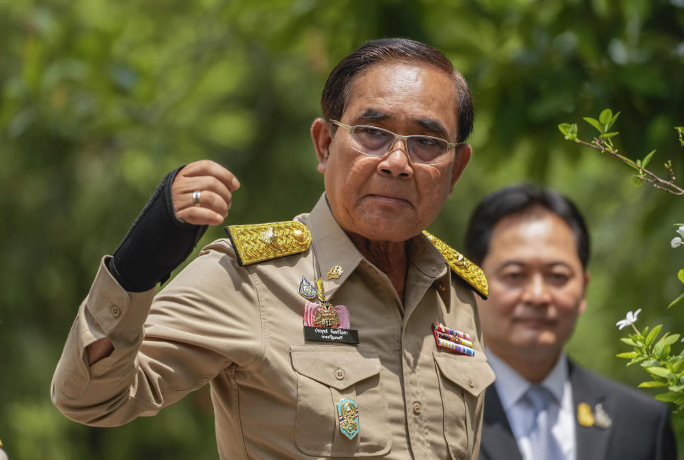 Thailand's Prime Minister Prayuth Chan-ocha talks to at reporters at the government house in Bangkok, Thailand, Monday, March 20, 2023. Thailand's Prime Minister Prayuth, who is seeking to be returned to office, announced that he has dissolved Parliament, setting the stage for a general election in May.(AP Photo/Sakchai Lalit)