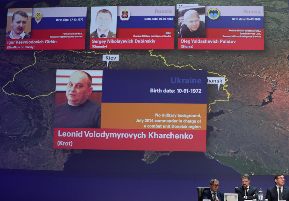 Russian nationals Igor Girkin, Sergey Dubinskiy and Oleg Pulatov, as well as Ukrainian Leonid Kharchenko, accused of downing of flight MH17, are shown on screen as international investigators present their latest findings in the downing of Malaysia Airlines flight MH17, nearly five years after the crash that killed 298 passengers and crew, in Nieuwegein, Netherlands, June 19, 2019.  REUTERS/Eva Plevier