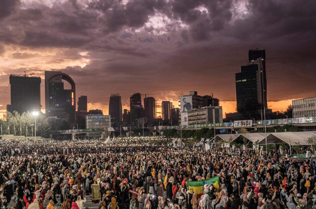 About 70% of people in Addis Ababa live in informal settlements that are vulnerable to climate change. Amanuel Sileshi/AFP/ <a href="https://www.gettyimages.com/detail/news-photo/muslim-devotees-gather-at-meskel-square-to-break-their-fast-news-photo/1240330823?adppopup=true" rel="nofollow noopener" target="_blank" data-ylk="slk:Getty Images;elm:context_link;itc:0;sec:content-canvas" class="link ">Getty Images</a>