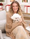 <p>LeAnn Rimes snuggles up with a rescue pup on the set of Hallmark Channel's <em>Home & Family </em>on Thursday in L.A. </p>