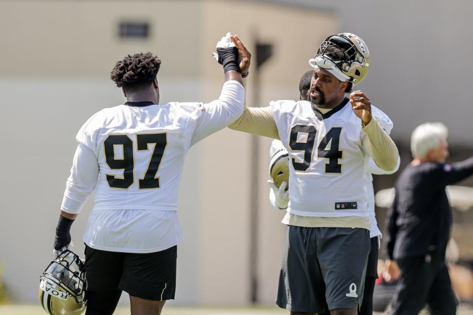 New Orleans Saints defensive linemen Malcolm Roach, right, and Cameron Jordan are among the few NFL defensive lineman that Texas' T'Vondre Sweat says he likes to study. Roach and Sweat were Longhorns teammates in 2019.