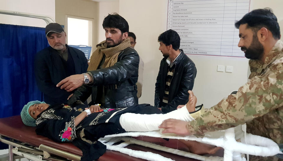 Samina, who was rescued after a heavy snowfall and avalanches in Bakwali village in Neelum Valley, receives first aid at a hospital in Muzaffarabad,