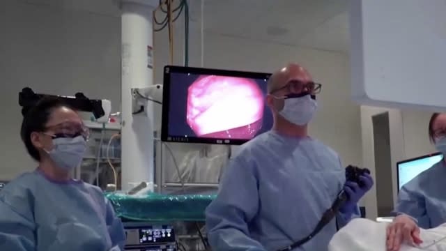 Doctors performing a colonoscopy