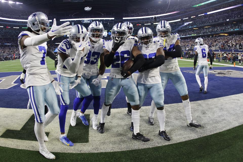 Dallas Cowboys' DaRon Bland celebrates his interception with teammates during the second half of an NFL football game against the Philadelphia Eagles Saturday, Dec. 24, 2022, in Arlington, Texas. (AP Photo/Ron Jenkins)