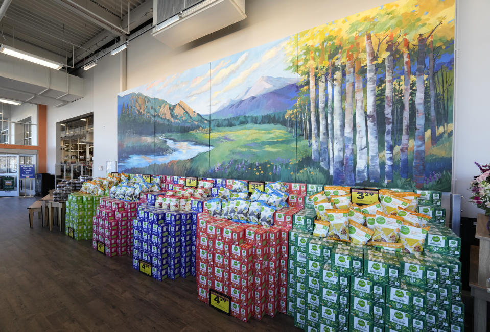 A mural by artist Lael Har entitled "A New Day" adorns the wall in the vestibule in the Table Mesa King Soopers grocery store during a media tour Tuesday, Feb. 8, 2022, in Boulder, Colo. Ten people were killed inside and outside the store when a gunman opened fire on March 22, 2021. The store reopens with new renovations on Wednesday, Feb. 9. (AP Photo/David Zalubowski)