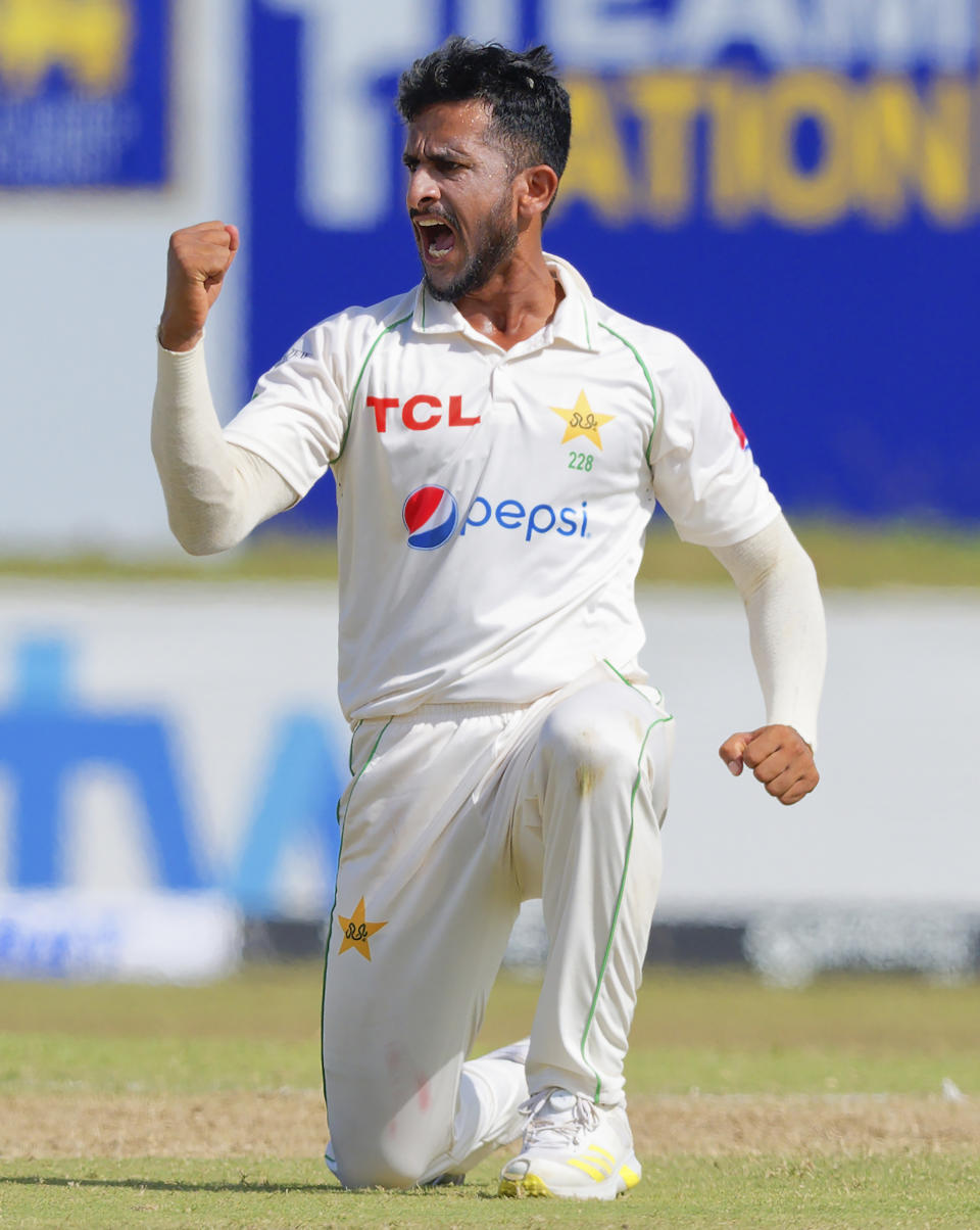 Pakistan's Hasan Ali celebrates the wicket of Sri Lanka's Dinesh Chandimal during the first day of the first test cricket match between Sri Lanka and Pakistan in Galle, Sri Lanka, Saturday, July 16, 2022. (AP Photo)