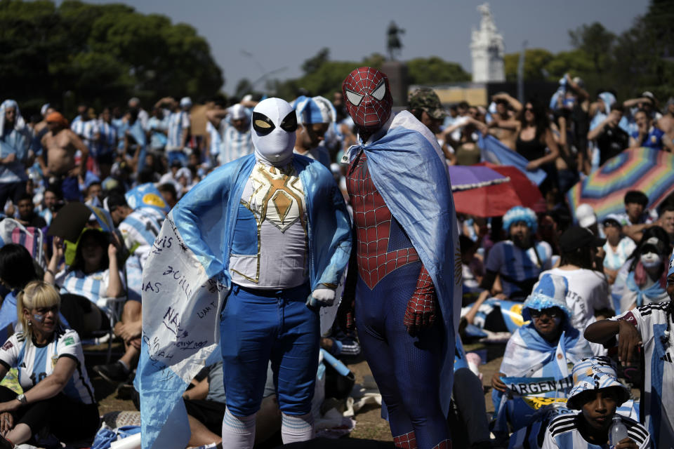 Argentina soccer fans dressed as superheroes watch their team's World Cup semifinal match against Croatia, hosted by Qatar, on a screen set up in the Palermo neighborhood of Buenos Aires, Argentina, Tuesday, Dec.13, 2022. (AP Photo/Rodrigo Abd)