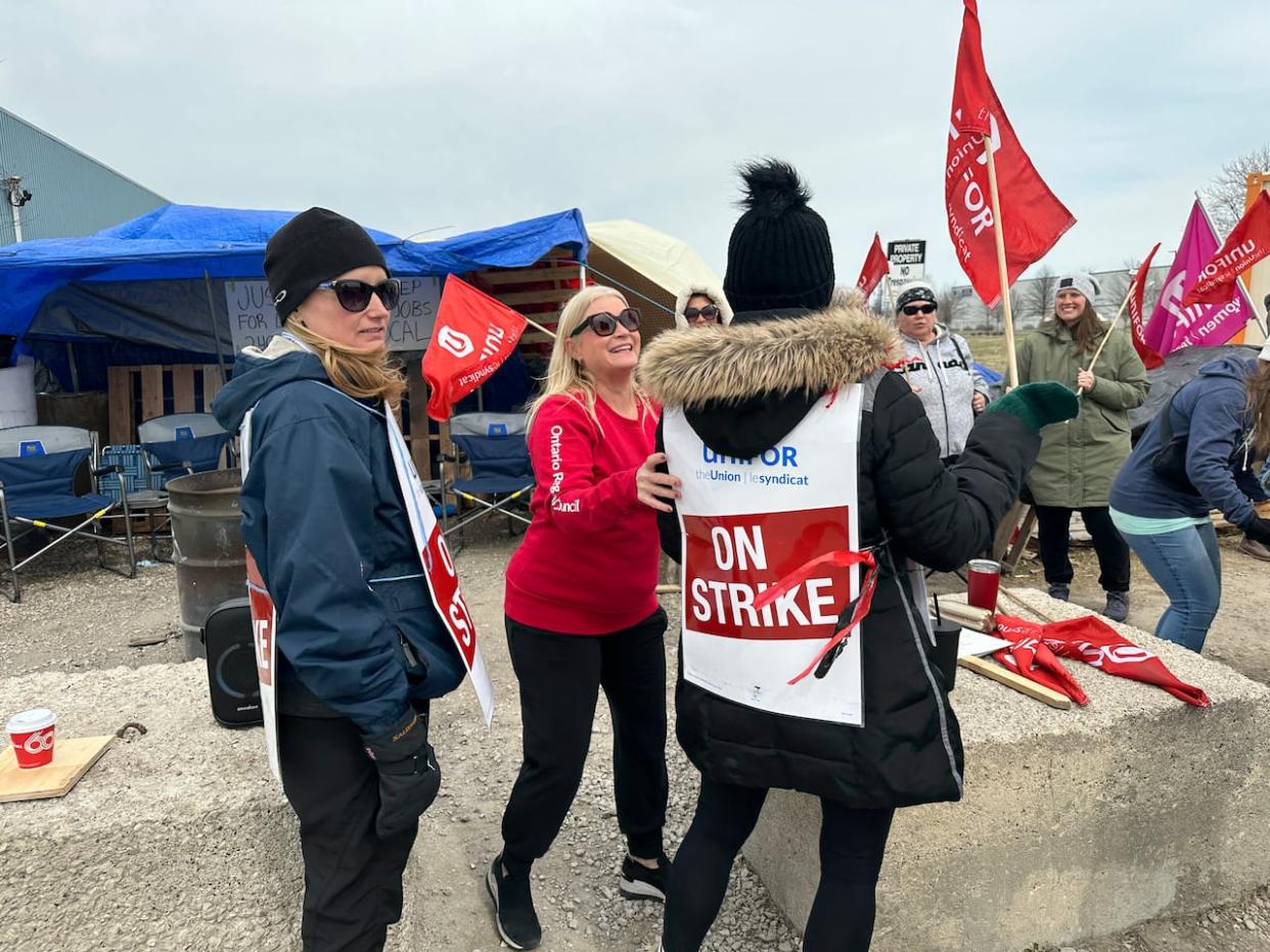 Unifor Local 240 preisdent Jodi Nesbitt on the picket line with striking GreenShield members on March 25, 2024. Workers are entering their fourth week on the line.  (Dale Molnar/CBC - image credit)