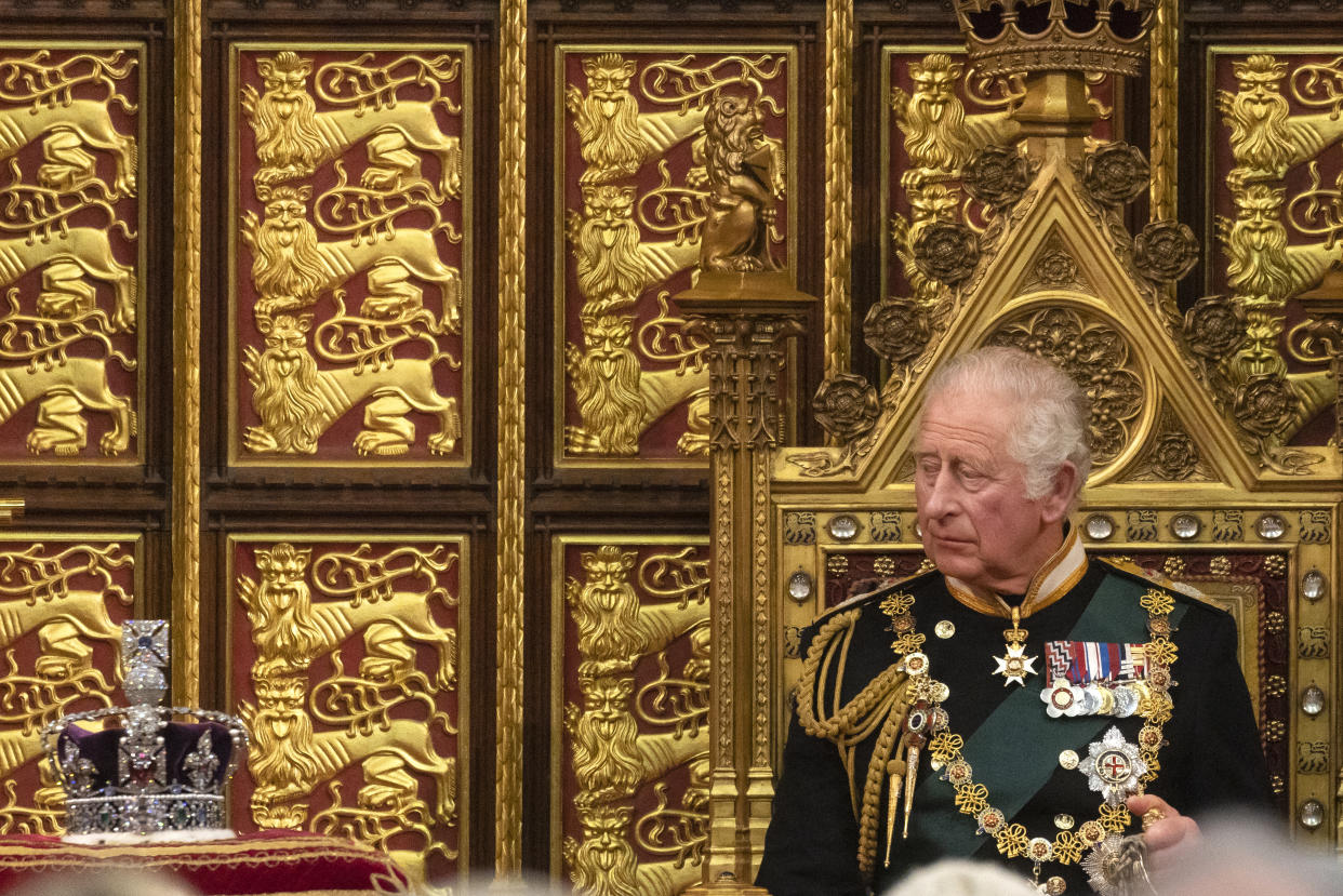 LONDON, ENGLAND - MAY 10: Prince Charles, Prince of Wales looks towards the Imperial State Crown as he delivers the Queen’s Speech during the state opening of Parliament at the House of Lords on May 10, 2022 in London, England. The State Opening of Parliament formally marks the beginning of the new session of Parliament. It includes Queen's Speech, prepared for her to read from the throne, by her government outlining its plans for new laws being brought forward in the coming parliamentary year. This year the speech will be read by the Prince of Wales as HM The Queen will miss the event due to ongoing mobility issues. (Photo by Dan Kitwood/Getty Images)