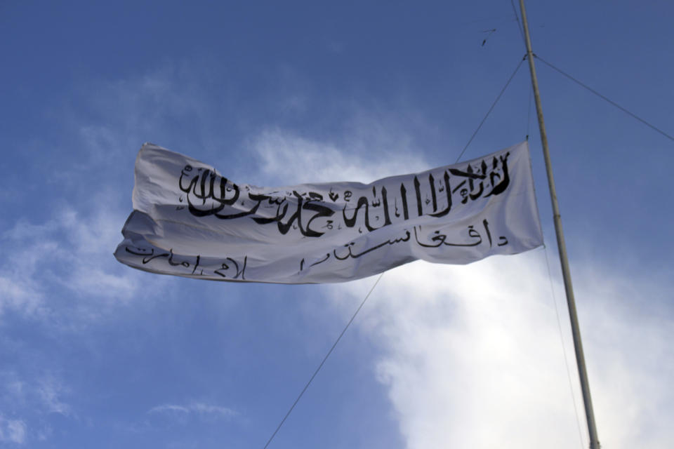 The Taliban flag flies at the Ghazni provincial governor's house in Ghazni, southeastern Afghanistan, Sunday, Aug. 15, 2021. (Gulabuddin Amiri/AP Photo)