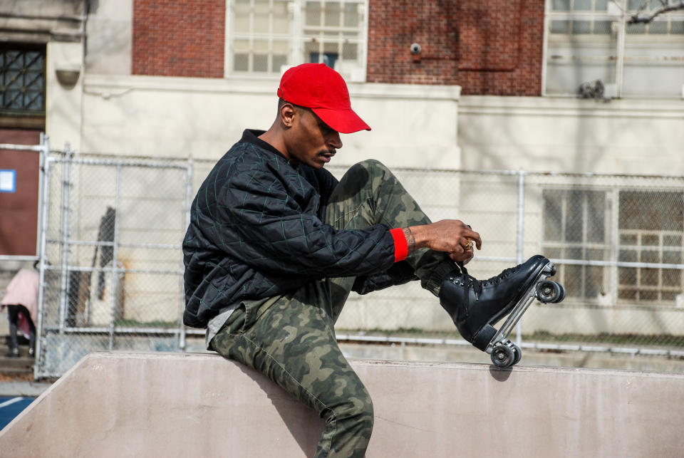 Harry Martin, founder of The Roller Wave, laces up his skates in a Harlem Park. (Janie Barber  / The Roller Wave)
