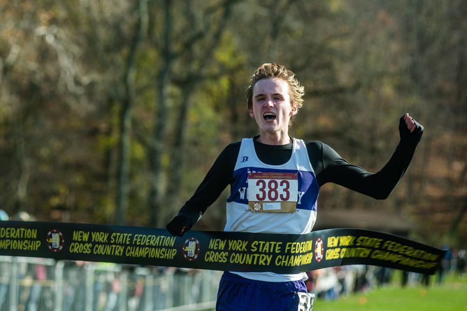 Monroe-Woodbury's Collin Gilstrap crosses the finish line during the New York Federation cross country championship at Bowdoin Park in Poughkeepsie on Saturday, November 19, 2022.