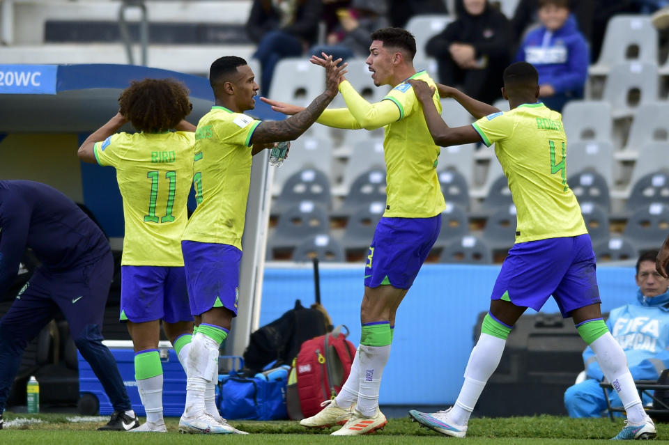 Brazil's Jean Pedroso, second from right, is congratulated after scoring his side's opening goal against Nigeria during a FIFA U-20 World Cup Group D soccer match at the Diego Maradona stadium in La Plata, Argentina, Saturday, May 27, 2023. (AP Photo/Gustavo Garello)