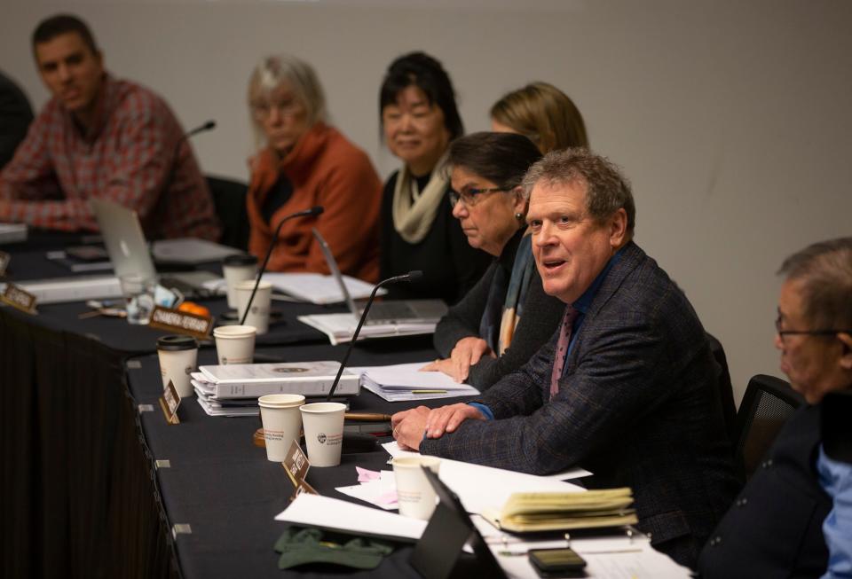 Jim Kelly, center, chair of the Oregon Board of Forestry, speaks during a meeting in Corvallis March 8, 2023.