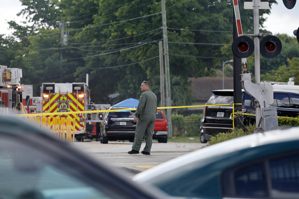 First responders work the scene after a Broward Sheriff's Office Fire-Rescue helicopter crashed in Pompano Beach near Fort Lauderdale, Fla., on Monday, Aug. 28. (Amy Beth Bennett/South Florida Sun-Sentinel via AP)