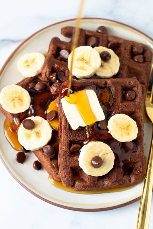 <p>Lexi's Clean Kitchen</p><p>Flourless, fluffy on the inside, crispy on the outside and full of chocolate banana flavor, plus they are made in one bowl.</p><p><strong>Get the recipe: <a href="https://lexiscleankitchen.com/double-chocolate-banana-waffles/" rel="nofollow noopener" target="_blank" data-ylk="slk:Gluten-Free Chocolate Banana Waffles;elm:context_link;itc:0;sec:content-canvas" class="link ">Gluten-Free Chocolate Banana Waffles</a></strong></p>