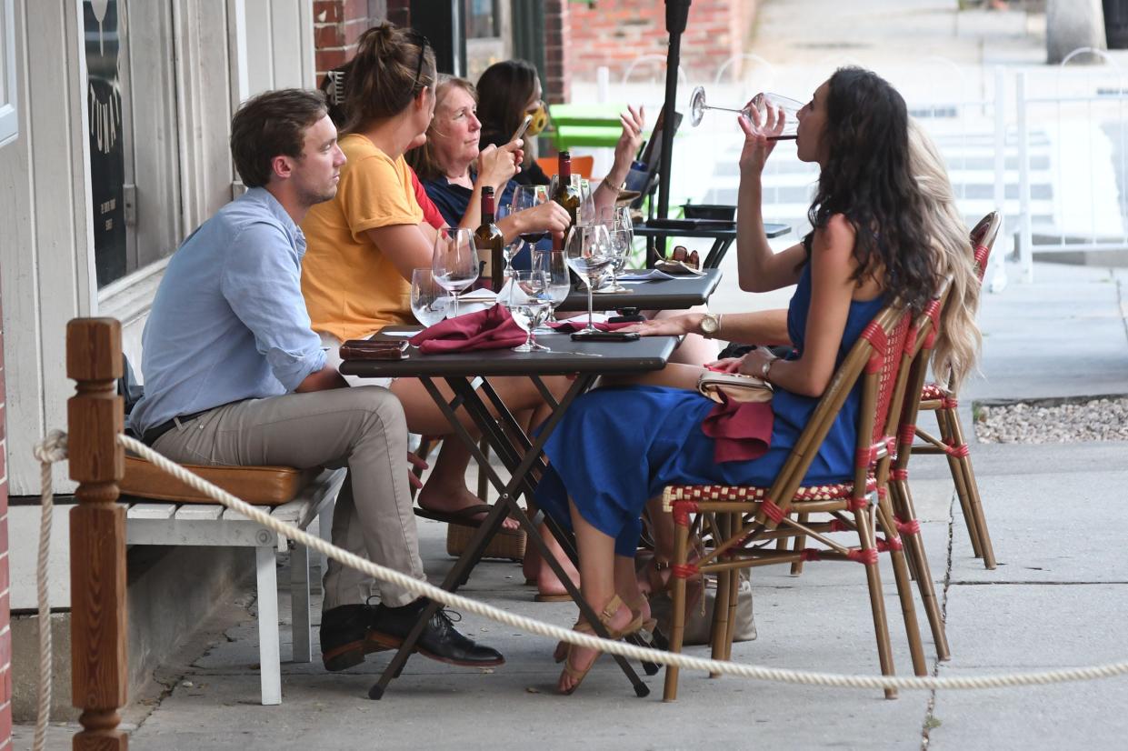 People eat outside The Fortunate Glass during Downtown Alive in Wilmington, N.C., Saturday, July 18, 2020. STARNEWS FILE PHOTO