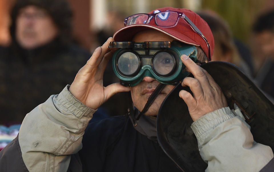 A man wears special glasses to watch a total solar eclipse in Chascomus, Argentina, July 2, 2019. (Photo: Gustavo Garello/AP)