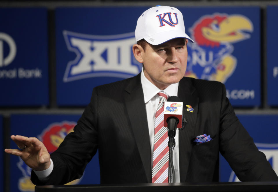 FILE - In this Nov. 18, 2018, file photo, University of Kansas new NCAA college football coach Les Miles makes a statement during a news conference in Lawrence, Kan. Miles and Kansas State counterpart Chris Klieman wrap up their initial recruiting classes, both having hit the ground running in their new gigs. (AP Photo/Orlin Wagner, File)