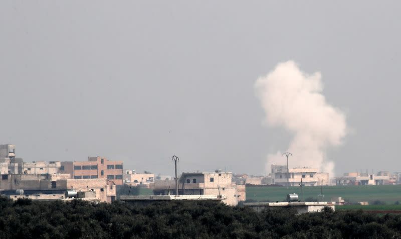 FILE PHOTO: Smoke rises after an air strike in Saraqeb in Idlib province