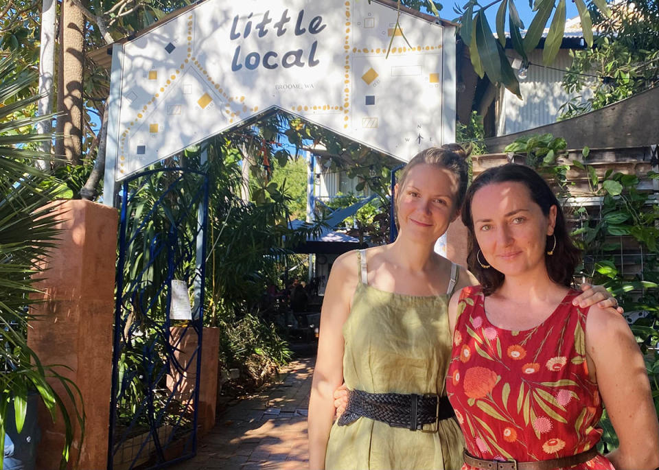 Two women standing outseide Little Local Cafe Broome. 