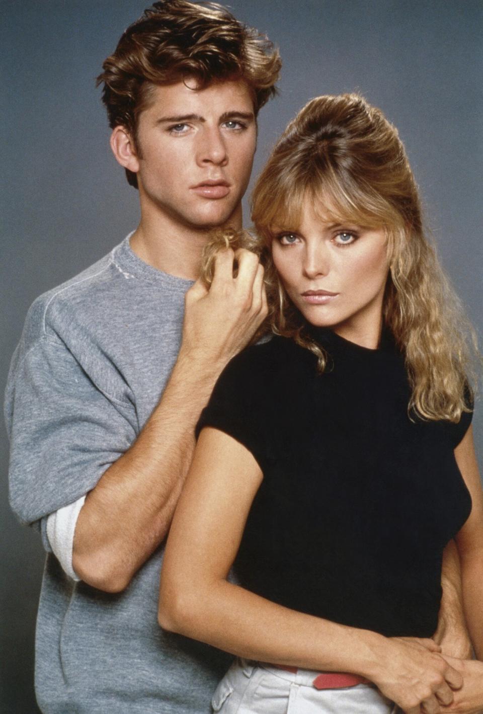 Michael Carrington (Maxwell Caulfield) and Stephanie Zinone (Michelle Pfeiffer)