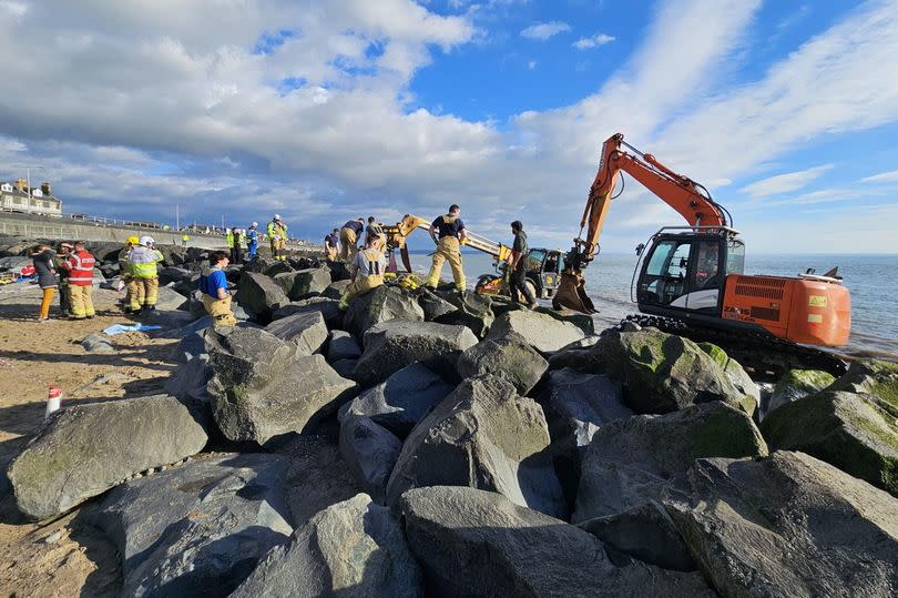 Diggers and lifting equipment was brought as a last option - using them risked disturbing the rocks in which the child was stuck