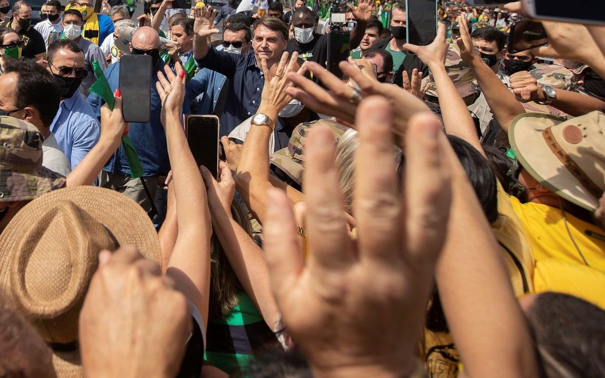 Brazilian president Jair Bolsonaro meets supporters during a demonstration, in Brasilia, Brazil - JoÃ©dson Alves/EPA-EFE/Shutterstock