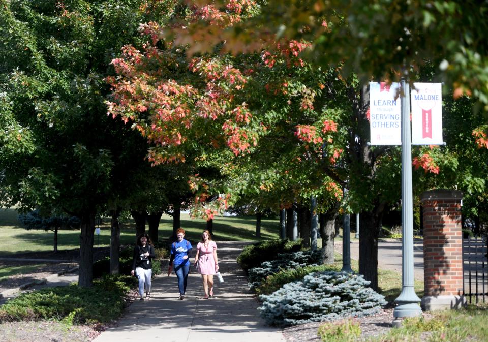 Students walk across the Malone University campus in Canton. Stark County universities and colleges say enrollment is stabilizing following the COVID-19 pandemic.