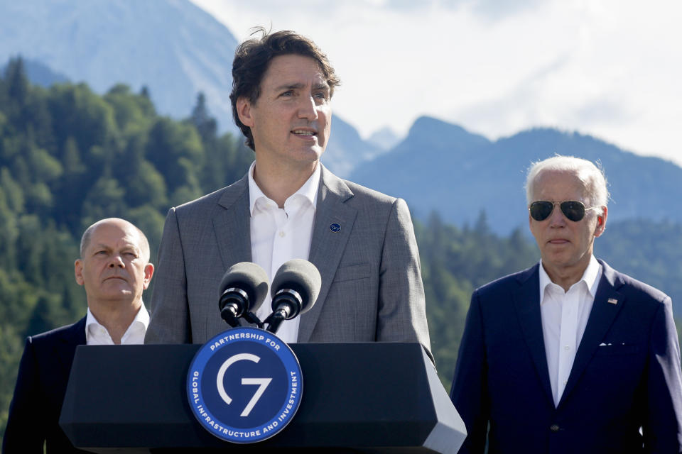 Canadian Prime Minister Justin Trudeau speaks next to German Chancellor Olaf Scholz and U.S. President Joe Biden during the first day of the G7 leaders' summit at Bavaria's Schloss Elmau castle, near Garmisch-Partenkirchen, Germany, Sunday, June 26, 2022. (Jonathan Ernst/Pool photo via AP)