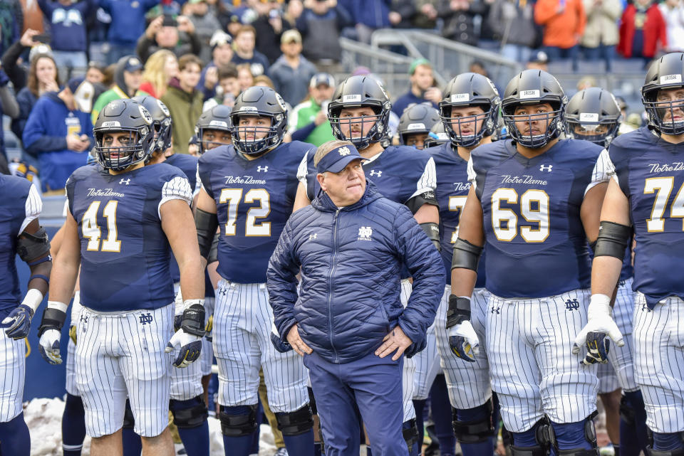 Notre Dame head coach Brian Kelly stands with his team before an NCAA college football game against Syracuse, Saturday, Nov. 17, 2018, at Yankee Stadium in New York. (AP)