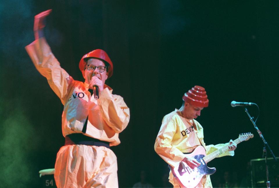 Mark Mothersbaugh and his guitarist brother Bob Mothersbaugh perform "Girl U Want" with Devo in 1997 at Blossom Music Center in Cuyahoga Falls.