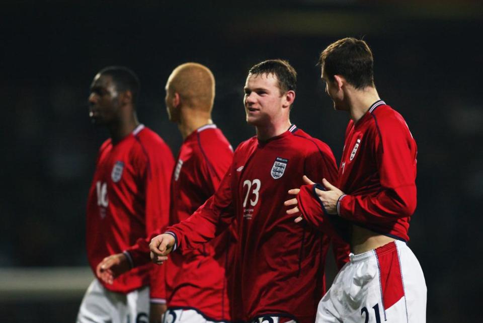 Then debutants Wayne Rooney and Francis Jeffers talk to each other on the pitch during the 2003 friendly