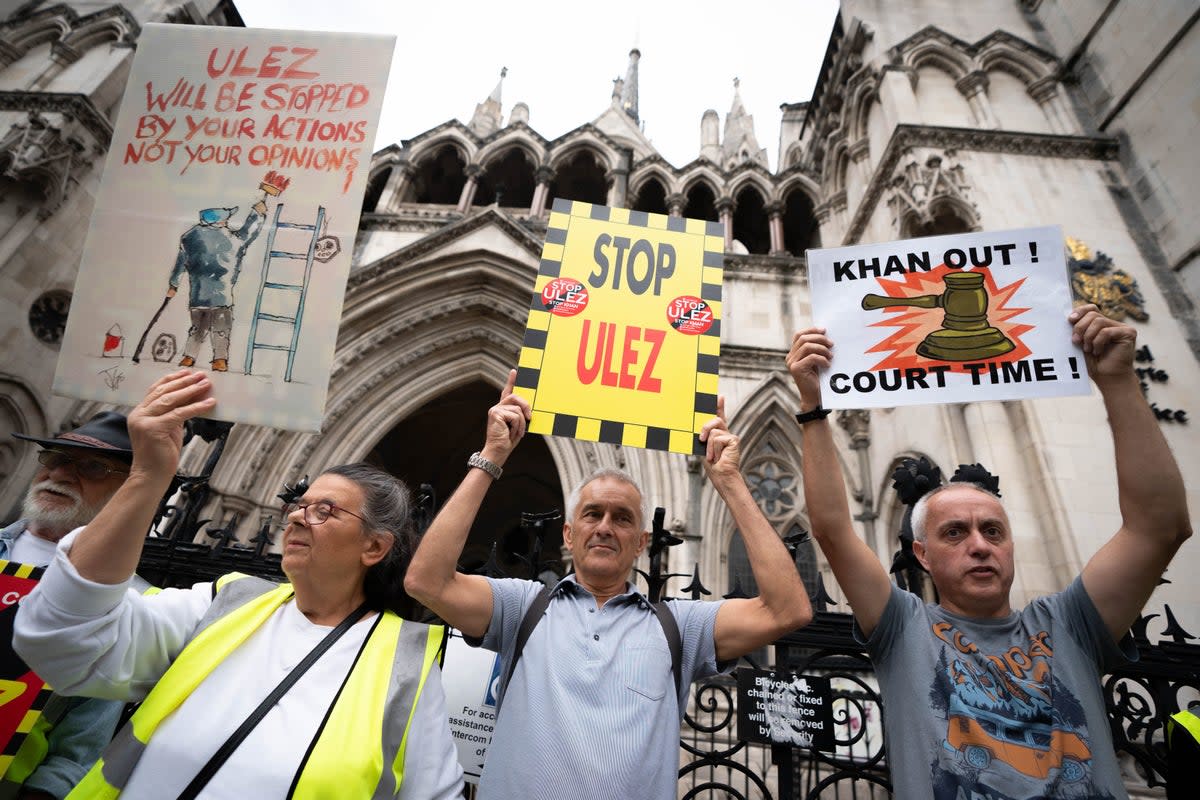 Anti-Ulez protesters outside the High Court, where five councils last week lost their challenge against plans to extend the ultra low emission zone (PA)