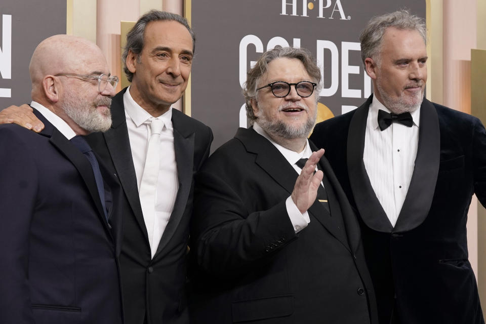 Roeban Katz, from left, Alexandre Desplat, Guillermo del Toro, and Mark Gustafson arrive at the 80th annual Golden Globe Awards at the Beverly Hilton Hotel on Tuesday, Jan. 10, 2023, in Beverly Hills, Calif. (Photo by Jordan Strauss/Invision/AP)