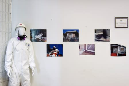 A display including protective clothing worn during lead abatement activities at the Alameda County Healthy Homes Department in Oakland