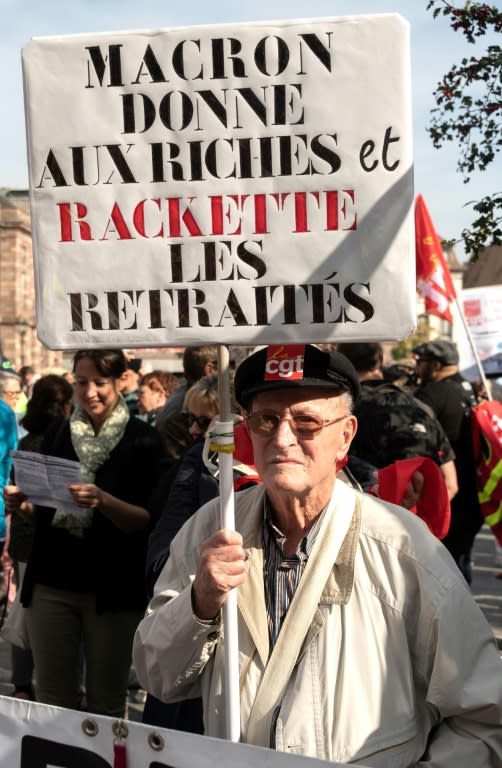 The spark that lit the revolt was Macron's perceived bias towards the rich, notably by scrapping wealth taxes on investors at the same time as he raised taxes on pensioners. The banner reads "Macron gives to the rich and cheats pensioners"